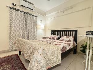 a bedroom with a large bed and a window at Premium 2BHK Apartment by Key Stays - Hyd in Hyderabad