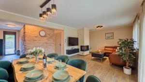 a dining room with a table and chairs at Villa Tia by Villas Guide in Karlovac