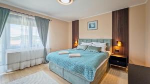 a bedroom with a bed and a large window at Villa Tia by Villas Guide in Karlovac +37 photos