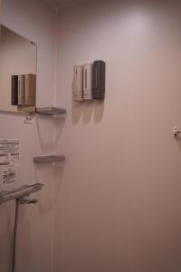 a room with two microwaves on a wall at 灯GuestHouse in Aizuwakamatsu +15 photos