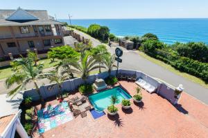 an aerial view of a hotel with a swimming pool and the ocean at Marilyn Boutique Hotel in Durban