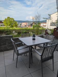 a table and chairs sitting on a patio at Seensucht in Bodman-Ludwigshafen +10 photos