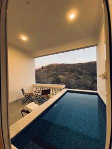 a swimming pool in a house with a view at JD Tara Resort in Ranakpur