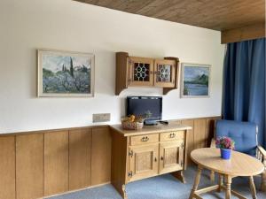 a waiting room with a desk with a computer on it at Chalet Cristall Superior Appartement 8 in Leutasch