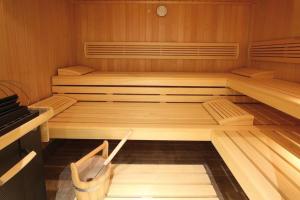 a sauna with two beds in a wooden room at Chalet Cristall Superior Appartement 8 in Leutasch +11 photos