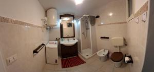 a bathroom with a sink and a shower and a toilet at Casa al Duomo in Augusta +20 photos