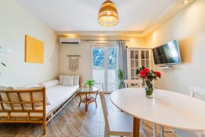 a living room with a couch and a table at Relaxing 2 bedroom apartment with Bay View and Parking in Prčanj