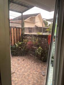 a view of a patio from the window of a house at Leon Mansion in Pulau Layang