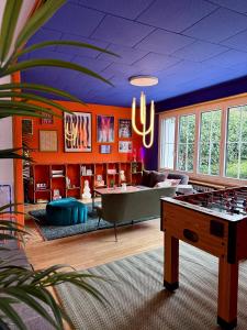 a living room with a pool table and chessboard at Sigma Self Check-in Hostel in Zurich