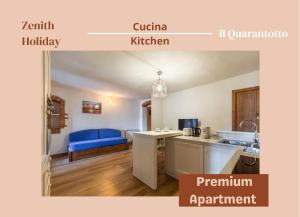 a kitchen with a blue couch in a room at Centro storico - 2 min da Piazza Grande - Free Parking in Arezzo