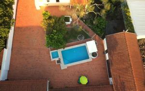 an overhead view of a swimming pool on a brick building at Casa dos Avós in Parceiros da Igreja