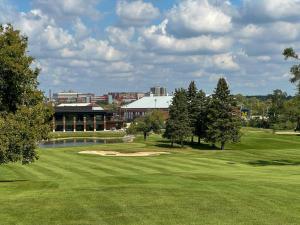 a golf course with a green and a pond at EVEN Hotel Ann Arbor S - University Area by IHG in Ann Arbor