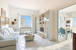a living room with a couch and a table at SottoVento in Imperia