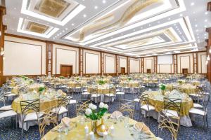 a banquet hall with tables set up for a wedding at Tolip Resort El Galala Hills in Ain Sokhna +77 photos