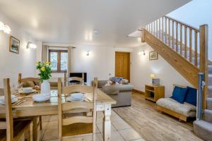 a living room with a table and a dining room at 2 Bed in Risca oc-b35977 in Risca