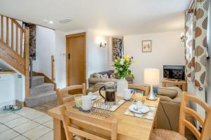 a kitchen and living room with a table and chairs at 2 Bed in Risca oc-h35978 in Risca