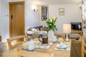 a living room with a dining room table with at 2 Bed in Risca oc-h35978 in Risca