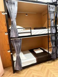 a couple of bunk beds in a room at Bachelor Stay - CBD Belapur in Navi Mumbai