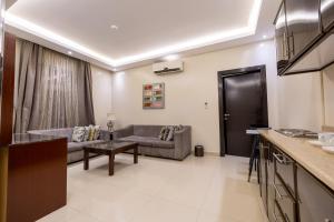 a living room with a couch and a table at Al Muhaidb Residence Al Malaz 1 - Economic in Riyadh +35 photos