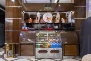 a food cart in a restaurant with drinks in it at Al Muhaidb Residence Al Malaz 1 - Economic in Riyadh