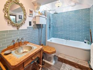 a bathroom with a sink and a toilet and a mirror at 2 Bed in Morpeth oc-l35201 in Morpeth +10 photos