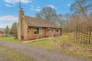 a brick house with a fence on the side of a road at 2 Bed in Beaconsfield oc-t35951 in Beaconsfield