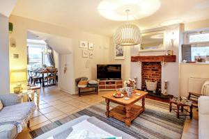 a living room with a couch and a fireplace at 3 Bed in Appledore oc-t28375 in Appledore