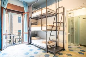 a room with bunk beds in a hostel at Ostello Bello Milano Duomo in Milan +54 photos