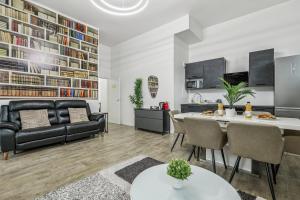 a living room with a couch and a table at NK Apartment in Bobigny in Bobigny
