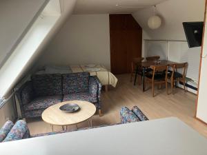 a living room with a couch and a table at Danninghus in Vindeby