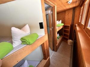 an overhead view of a room with bunk beds at Abenteuer Turm in Braunwald +36 photos