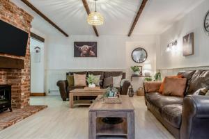 a living room with a couch and a fireplace at 3 Bed in Shanklin oc-b36038 in Shanklin