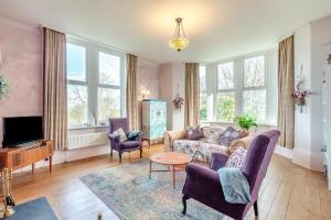 a living room with a couch and chairs and a tv at 2 Bed in Shepley oc-c36884 in Shepley