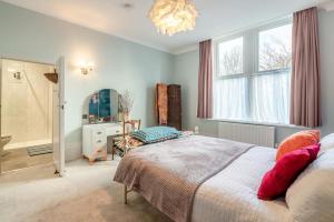 a bedroom with a bed and a window and a mirror at 2 Bed in Shepley oc-c36884 in Shepley