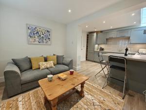 a living room with a couch and a table and a kitchen at 1 Bed in Hexham oc-g37537 in Hexham