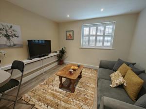 a living room with a couch and a tv at 1 Bed in Hexham oc-g37537 in Hexham