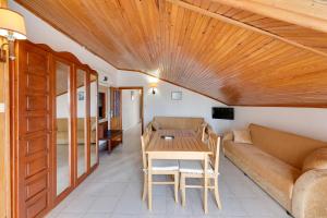 a living room with a couch and a table at NATURELLA APART HOTEL in Kemer