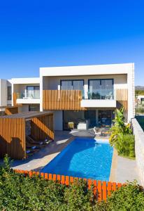 an image of a house with a swimming pool at Aethrion Villas & Suites in Gennadi