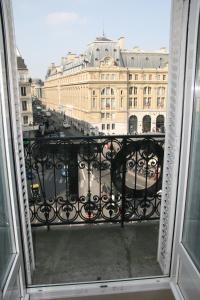 a view of a city from a balcony at Hotel Bellevue Saint-Lazare in Paris