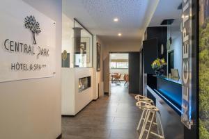 a hallway with a bar and a dining room at BW Plus Central Park Hotel & Spa in La Rochelle +43 photos