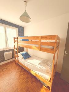 a bedroom with two bunk beds in a room at A CasA in Linxe