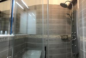 a shower with a glass door in a bathroom at Royal Promenade in Nice +20 photos