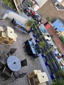 an overhead view of a patio with tables and chairs at Harry's Hotel in Aberystwyth