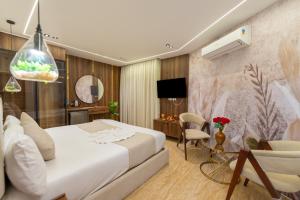 a bedroom with a bed and a living room at The Muse Luxury View Hotel in Cairo +140 photos