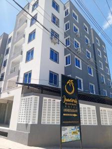 a building with a sign in front of it at vale mombasa nyali in Mombasa