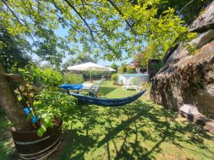a hammock in a garden under a tree at Casa Paz in Nigrán