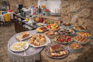 a table with many different types of food on it at Proserpina in Enna
