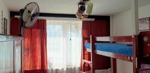 a bedroom with two bunk beds and a window at Room for you in Warsaw