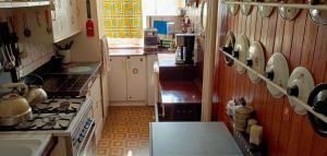 a kitchen with a stove and a stove top oven at Room for you in Warsaw +19 photos