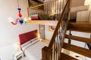 a living room with a staircase and a couch at Foresteria Levi in Venice +46 photos